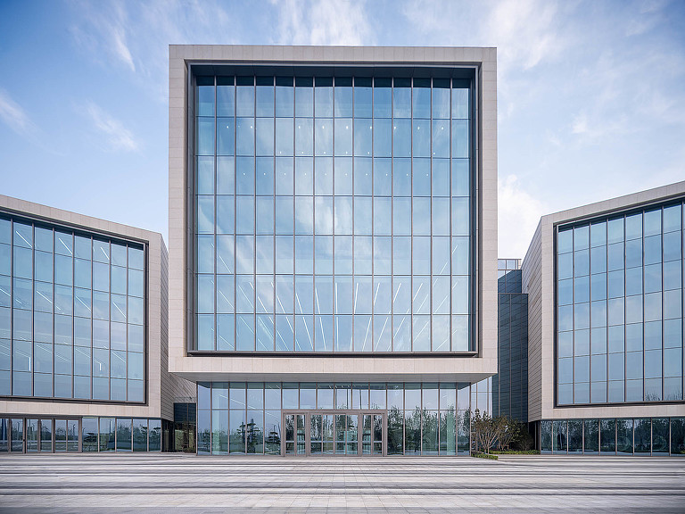 Exterior of a large building with glass windows.